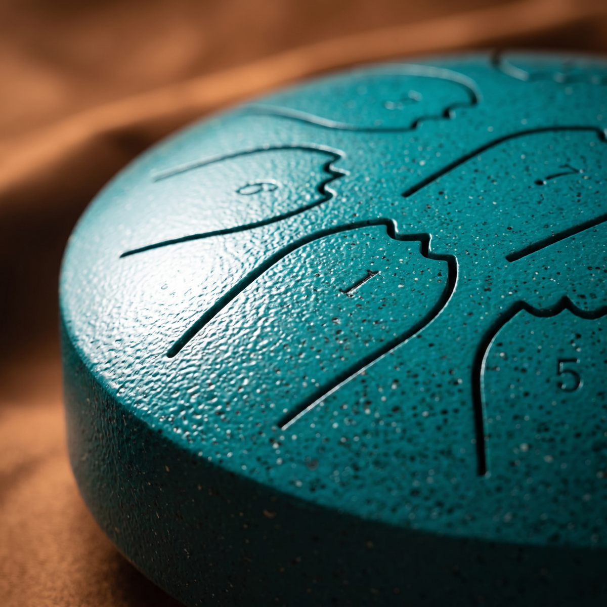 Margaret's hand-tuned rain drum, teal pearl finish, side closeup
